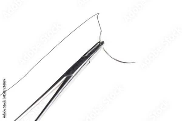 Fototapeta Close-up of a surgical needle threaded with non-absorbable suture. Sharp point and fine thread against a white background.