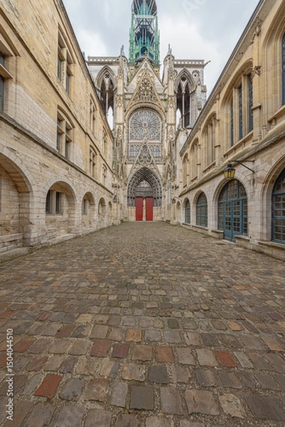 Fototapeta Wide view of a side entrance of the Notre Dame Cathedral in Rouen with features from Early Gothic to late Flamboyant and Renaissance architecture