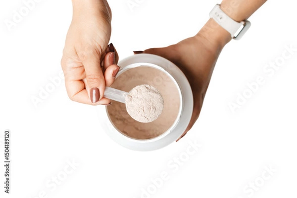 Obraz Woman's hands holding measuring spoon with whey protein powder over a jar, preparing a protein drink cocktail, top view, isolated on a transparent background
