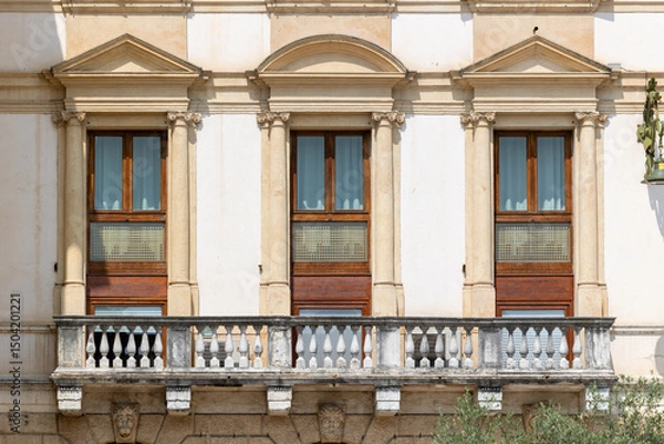 Fototapeta Classical European Palace Facade with Ornate Columns, Pediments and Stone Balustrade