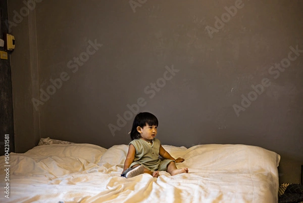 Obraz Child Is Playing On The Bed In The Bedroom