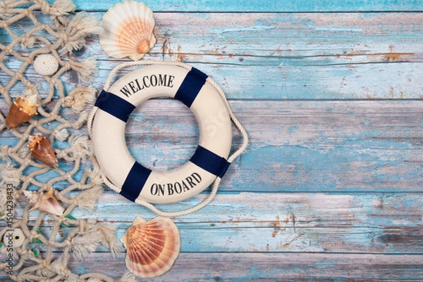 Fototapeta Nautical background with shells, rope and a lifebuoy