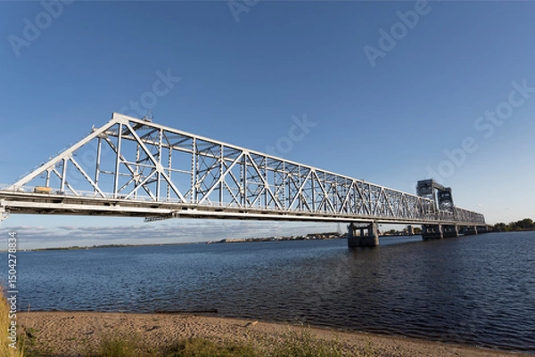 Fototapeta View on Severodvinsk Bridge is a road, railway and pedestrian bridge in the city of Arkhangelsk across the Severnaya Dvina River. Russia