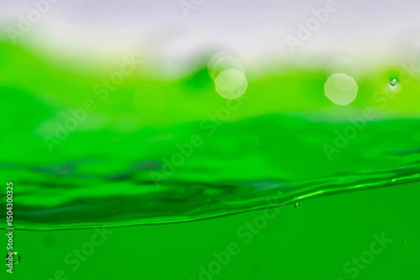 Fototapeta Water wave, close up of vibrant green liquid with bubbles, capturing dynamic movement and freshness. Perfect for backgrounds, beverages, or abstract concepts. soft drink