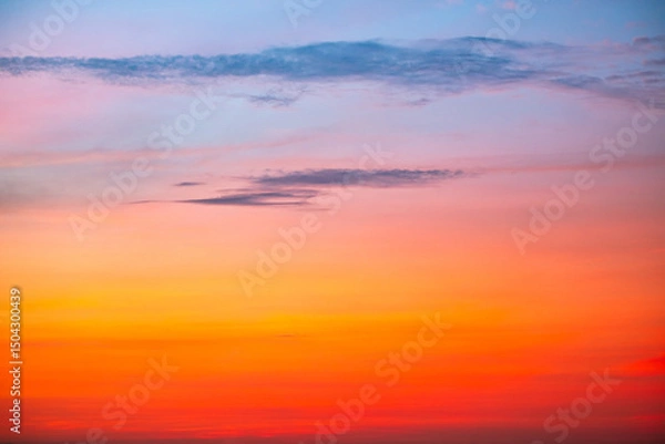 Fototapeta Sky,Beautiful sunset view, luxury soft gradient orange gold clouds and sunlight on the blue dramatic sky perfect for the background, morning, evening,Twilight, climate change,horizontal sunset photo