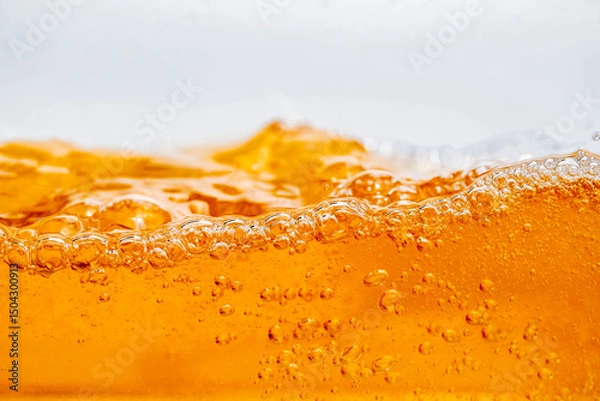 Fototapeta Close up bright orange Oil or beer splash texture and nature waves, Beautiful waves curve and little bubbles smooth for graphic design and background, Oil Bubbles, Soft beer bubbles, Selective focus