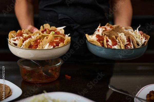 Fototapeta Serving of Fresh Homemade Tacos with Salsa, Cabbage, and Tortillas Displayed in Ceramic Bowls