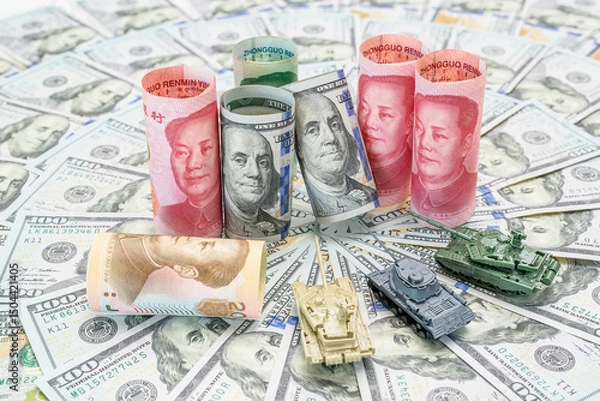 Fototapeta Economic conflict and diplomacy : Chinese yuan and US dollar bills rolled with miniature tanks represent the trade tension, financial battleground between the world's largest economies, US and China.