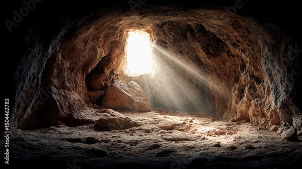 Obraz Sunlight streams through a small cave opening, illuminating the rough, rocky interior with a warm, natural glow.