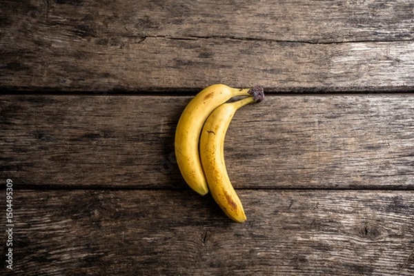 Obraz Two ripe bananas on rustic wooden background