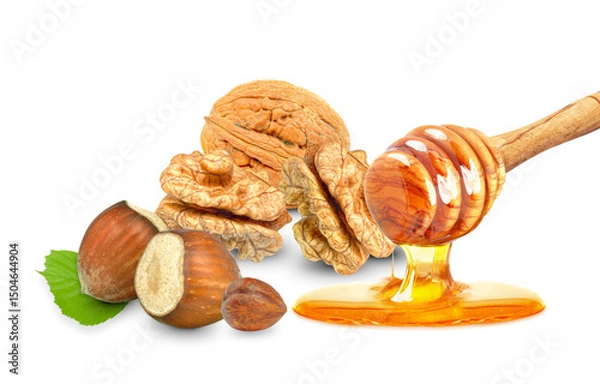 Fototapeta dripping honey and hazelnuts and walnuts isolated on white background