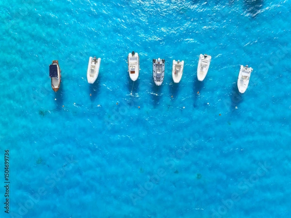 Fototapeta Vacation and leisure. Seascape with motorboat. Aerial view on fast boats on blue Mediterranean sea at sunny day. Fast ships on the sea surface. Seascape from the drone.