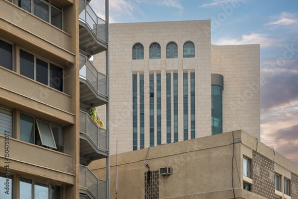 Fototapeta old real estate Israeli building with modern background highlights contrast in secondary housing market architecture
