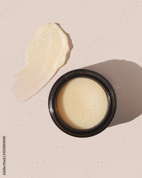Fototapeta Natural and organic beef tallow balm on tan background with product texture