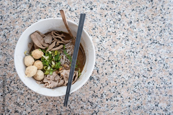 Obraz Thai pork noodles on a marble table..