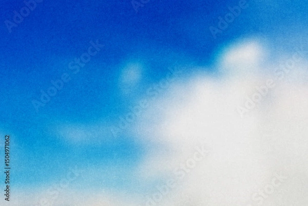 Fototapeta ざらざらの紙とぼやけた夏の青空と白い雲の画像