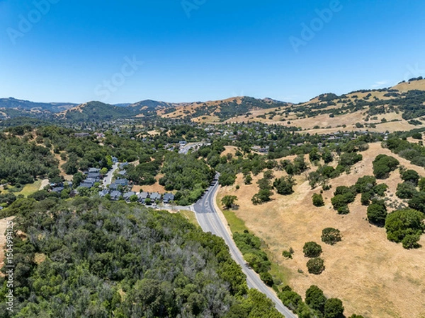 Obraz Aerial views of the San Marin neighborhood and surrounding hills in Marin County, California. Suburban homes, winding roads, and oak-dotted golden hills define the scenic North Bay landscape.