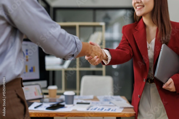 Obraz Happy young business woman asian manager handshaking client at meeting. Smiling female hr hiring recruit at job interview, insurance agent, lawyer making contract deal at work with business handshake.