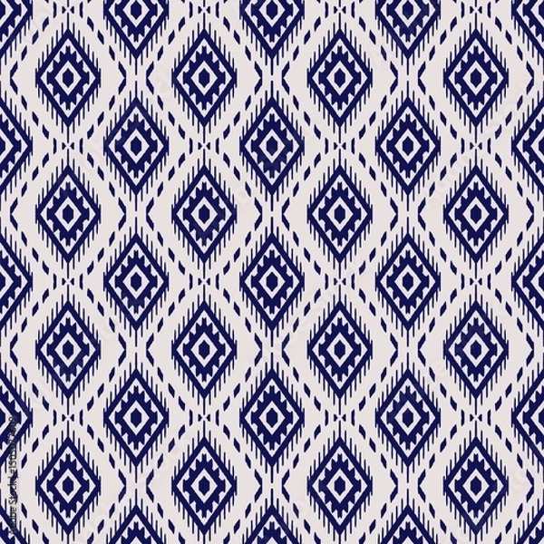 Obraz Geometric pattern featuring interlocking diamond shapes in a navy blue hue on a light beige background. 