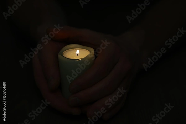 Obraz Hands Holding Lit Candle in Dark Background - Peace, Calm and Serenity