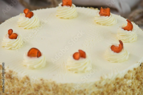 Fototapeta Elegant Carrot Cake with Cream Cheese Frosting and Drizzle spiced cake layers covered in smooth cream cheese frosting top is elegantly drizzled with caramel closeup view of delicious cake