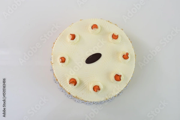 Fototapeta Elegant Carrot Cake with Cream Cheese Frosting and Drizzle spiced cake layers covered in smooth cream cheese frosting top is elegantly drizzled with caramel top view of delicious cake