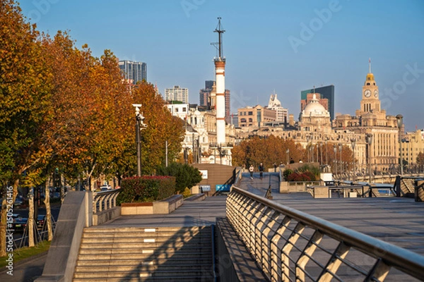 Obraz Morning sunrise of Historical architecture on the bund of Shanghai with reflection of buildings in city Shanghai, China