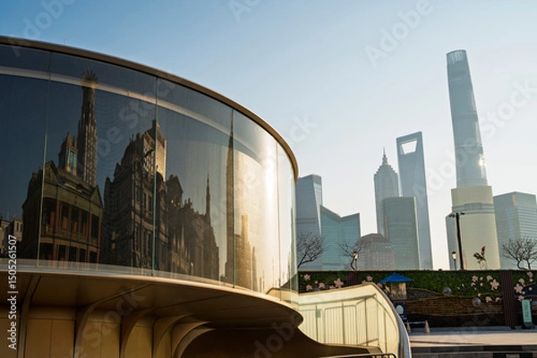 Obraz Morning sunrise of Reflax ofHistorical architecture on the bund of Shanghai in window and  Shanghai city modern skyscraper cityscape with reflection of buildings in city Shanghai, China