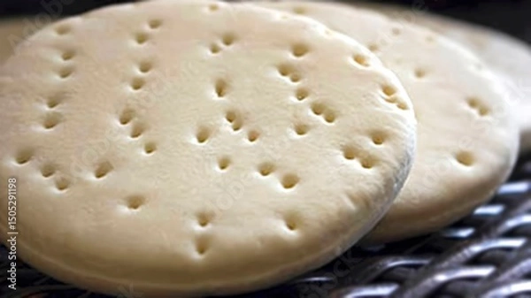 Obraz A bakery's fresh petta, a type of bread that resembles a bun, made for consumption.
