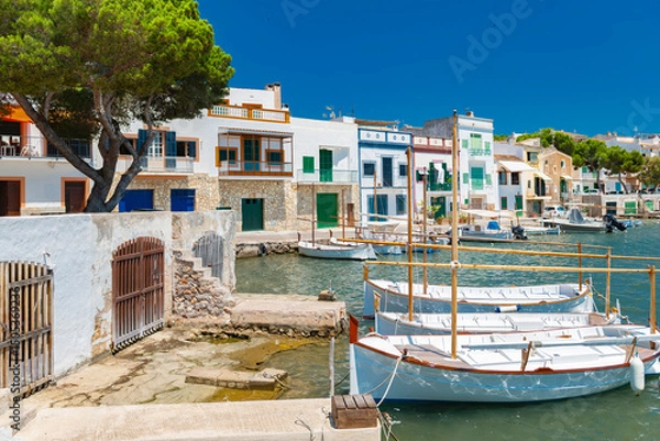 Fototapeta Old town at the harbor of Portocolom with traditional boats in front of the boathouses - 2991
