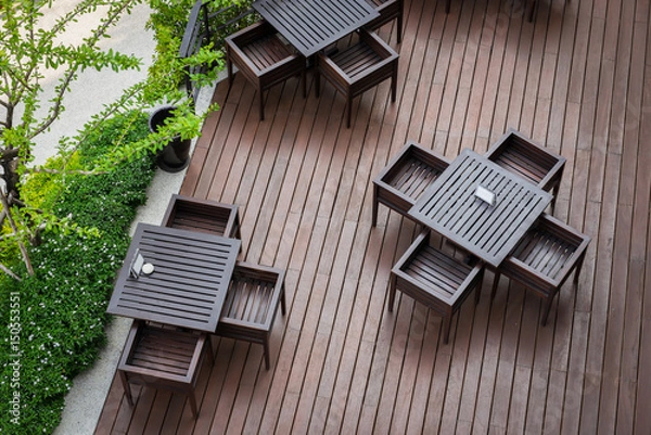 Obraz Top view of table and four chairs on living terrace at cafe.
