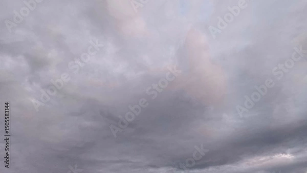 Fototapeta Gray cloudy sky with soft overcast light, creating a calm and moody atmosphere ideal for weather, backgrounds, or cinematic visual projects.