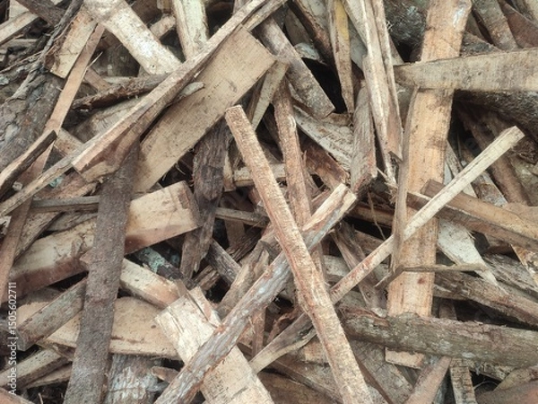 Obraz A pile of wood chips for fuel represents renewable energy, offering a sustainable alternative to fossil fuels and supporting eco-friendly heating and power solutions.