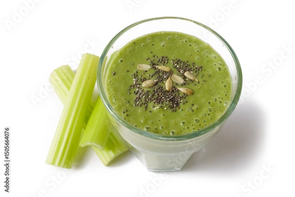 Fototapeta spinach and celery stems detox diet smoothie with chia and sunflower seeds, healthy eating