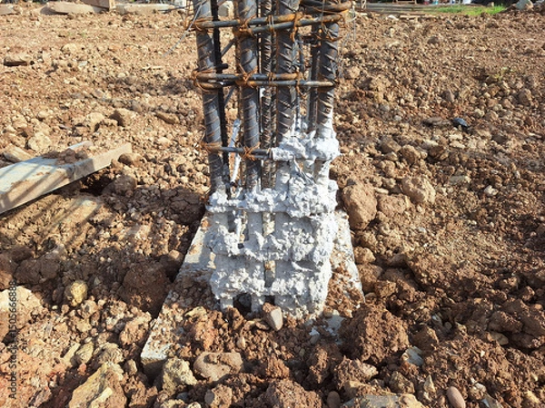 Obraz Cement fragments stuck to the building's structural steel columns.