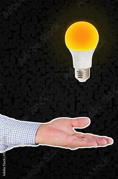 Fototapeta Hand Presenting a Brilliant Idea: Glowing Light Bulb Hovers Above