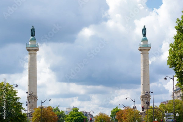 Fototapeta  Two columns of the barrière du Trône in The Place de la Nation. 11th arrondissement of Paris city