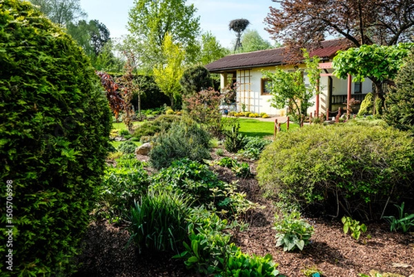 Obraz A very beautiful garden house in a neat and tidy allotment in summer. Gardening, allotments, urban gardening