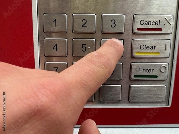 Fototapeta dial the code digits on the ATM