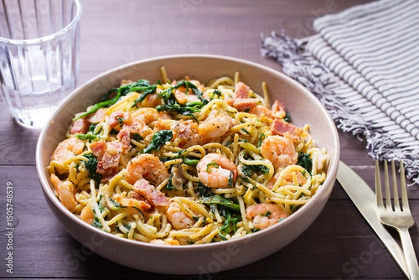 Fototapeta Prawn and bacon pasta with spinach. Spaghetti