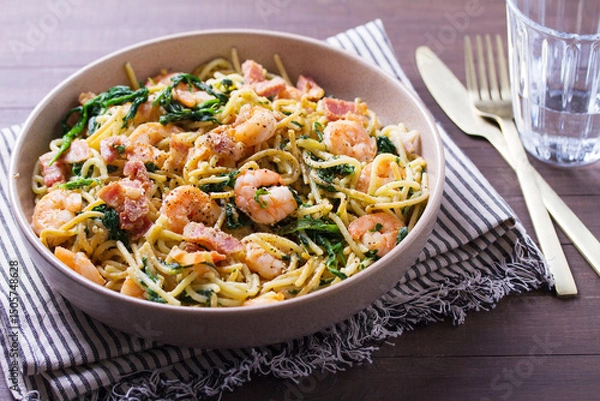 Fototapeta Prawn and bacon pasta with spinach. Spaghetti
