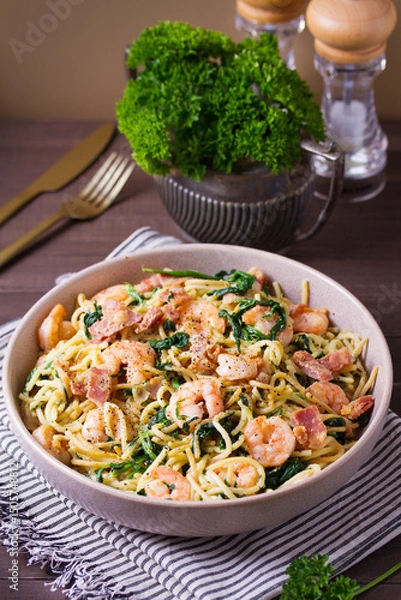 Fototapeta Prawn and bacon pasta with spinach. Spaghetti