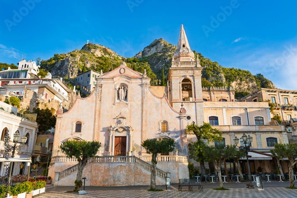 Obraz Morning view of Piazza IX Aprile with the Church of San Giuseppe in Taormina, Sicily. The historic square offers a stunning perspective of Taormina's charming architecture and landscape