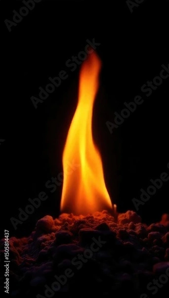 Fototapeta A single, smoldering ember glows intensely against a stark black background, isolated and alone, representing the feeling of being fired and alone , light, abandoned