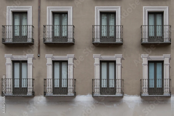 Fototapeta facade with balconies with painted lintels simulating marble frames