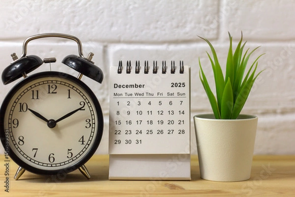 Fototapeta Hello, December 2025. A desktop calendar for planning on the table.