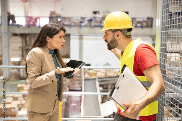 Fototapeta A conflict in a warehouse setting highlights the tension between management and employees over workplace decisions.