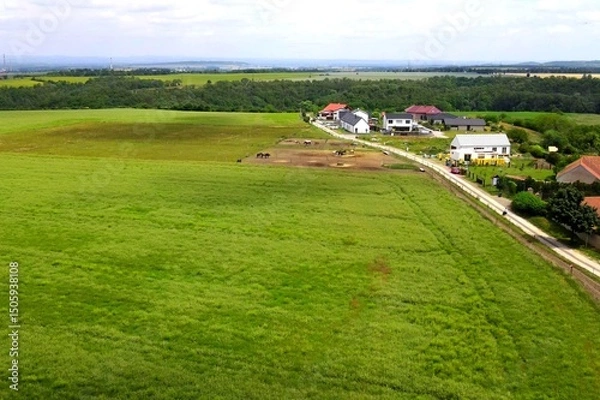 Obraz Land for sale and investment , aerial view. Include green field, agriculture farm. That real estate or property. Plot of land lot