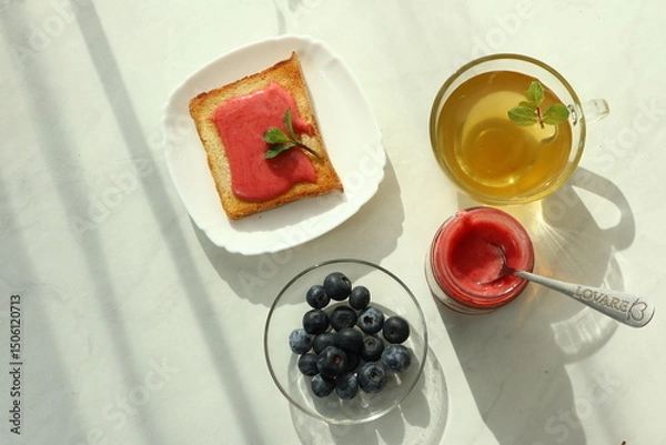 Fototapeta Tasty breakfast with toasts on table