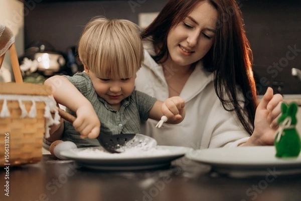 Fototapeta Emotional bonding moment as mother and toddler enjoy flour play in kitchen exploring spring rituals mindful connection and homeschool-inspired creativity through textures rhythm and shared attention